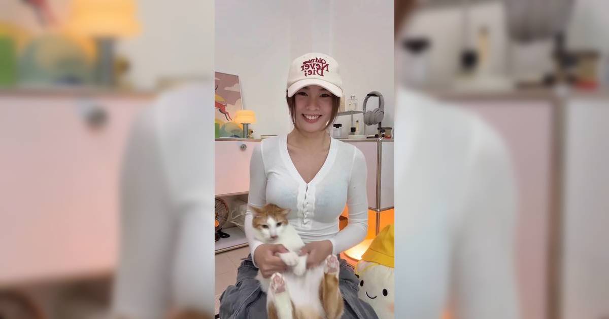 熊仔頭卡姐白色透視上衣勁吸睛 一人一貓跳舞放電 網民想做佢寵物！